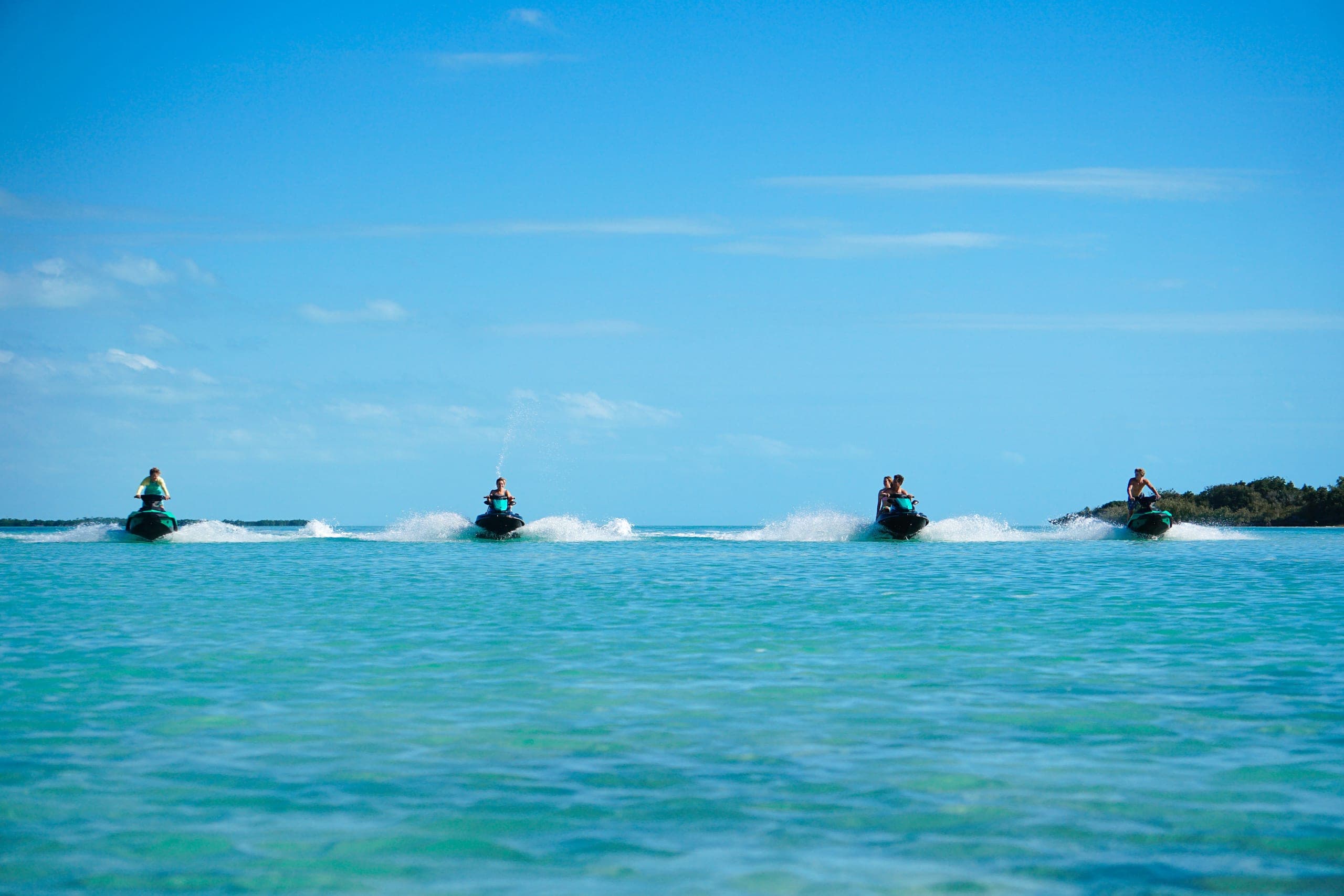 Jet skis crossing the turquoise flats of Turks & Caicos